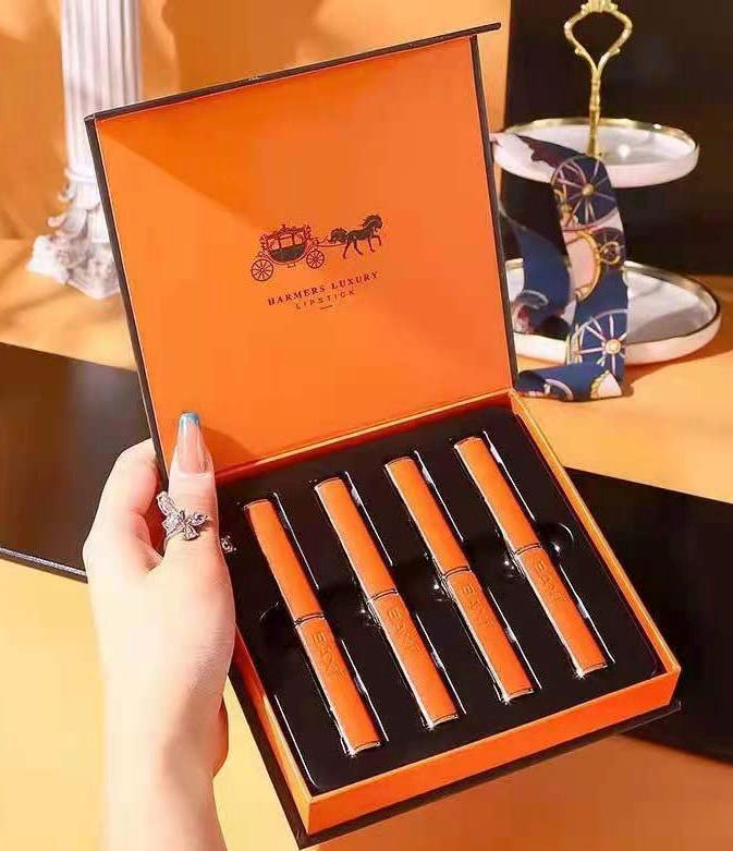 A gift box with 4 different colors pen lipstick