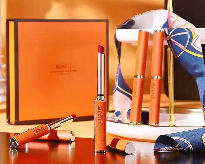 A gift box with 4 different colors pen lipstick